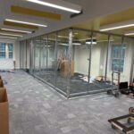 The Lane Road branch first floor with new carpeting, lighting, and 2 glass enclosed meeting spaces.