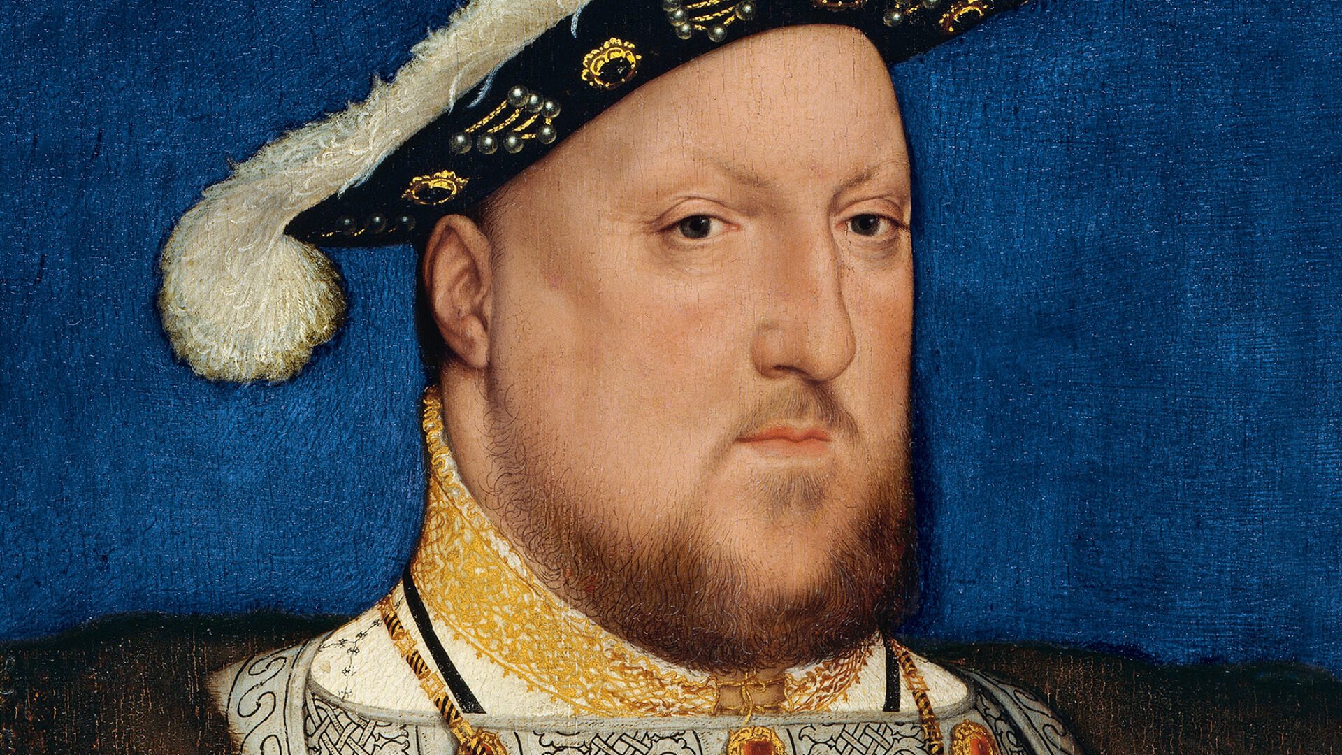 Painting of King Henry VIII, wearing a feathered hat and gold jewelry.