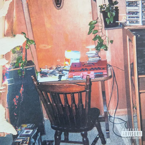 Album cover. Cluttered vintage home studio with a red keyboard, wooden chair, and potted plants. Includes a Parental Advisory logo.