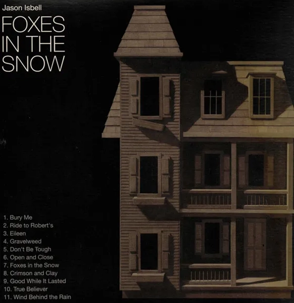 Album cover for Jason Isbell's Foxes in the Snow showing a dollhouse against a black background.
