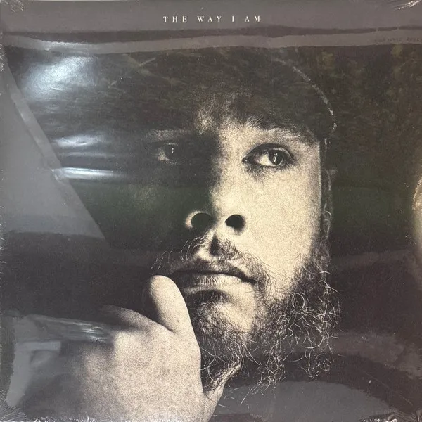 Close-up portrait of a bearded man with hand on chin on the Combs: "The Way I Am" album cover.